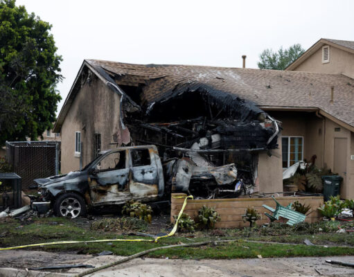 A view shows a damage house and vehicle at the crash scene, after a small civilian aircraft went down in a military neighborhood in San Diego, California, U.S. May 22, 2025. REUTERS/Mike Blake