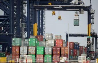 Containers are stacked at the Port of Felixstowe, UK, January 28, 2021. Picture taken January 28, 2021. REUTERS/Peter Cziborra/File Photo
