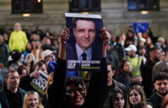 Supporters of Presidential candidate Nicusor Dan react, following exit polls of Romania's second round of the presidential election, in Bucharest, Romania, May 19, 2025. REUTERS/Andreea Campeanu