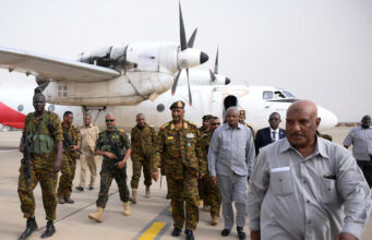 Sudan's General Abdel Fattah al-Burhan arrives with his officials and guards in the military airport of Port Sudan, Sudan, August 27, 2023. REUTERS/Ibrahim Mohammed Ishak/File Photo
