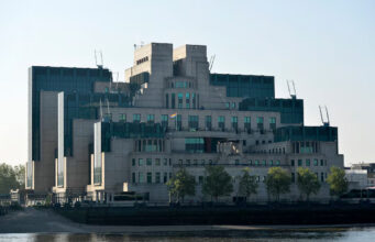 The MI6 Vauxhall Cross building raises the Rainbow Flag to mark its support for the International Day Against Homophobia, Transphobia and Biphobia in London, Britain, May 17, 2016. REUTERS/Hannah McKay/File Photo