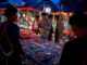 A man buys foods at a market as Thailand is to inject $15.2 bln into economy next year through its digital wallet policy, in Bangkok, Thailand, October 2, 2023. REUTERS/Athit Perawongmetha/File Photo