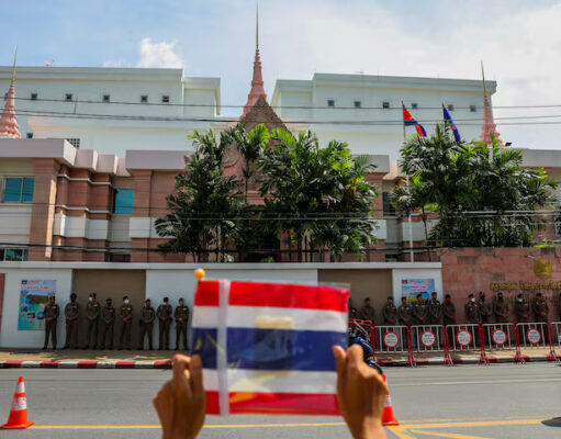 A royalist activist holds a Thai flag as he protests in front of the Royal Embassy of Cambodia, following a recent clash at the Thailand-Cambodia border on May 28, 2025, in Bangkok, Thailand, June 6, 2025. REUTERS/Chalinee Thirasupa/File Photo