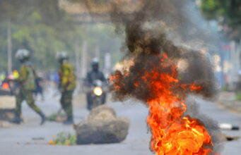 Smoke and fire rise at the site after riot police officers dispersed protesters during demonstrations in Nairobi, Kenya, June 25. REUTERS/John Muchucha