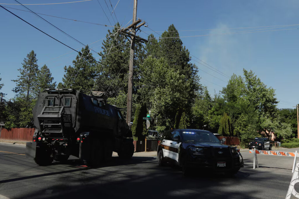 An armored police vehicle travels towards an area where multiple firefighters were attacked when responding to a fire in the Canfield Mountain area outside Coeur d’Alene, Idaho, U.S. June 29, 2025. REUTERS/Young Kwak