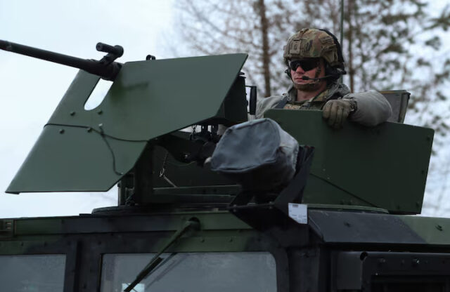 KDNFEU2KQZLT3HIYDFA6M6SKII US Army soldiers from the 82nd Airborne Division drive HMMWV (Humvee) vehicle towards an airbase near Arlamow, Poland, April 5, 2022. REUTERS/Kacper Pempel/File Photo
