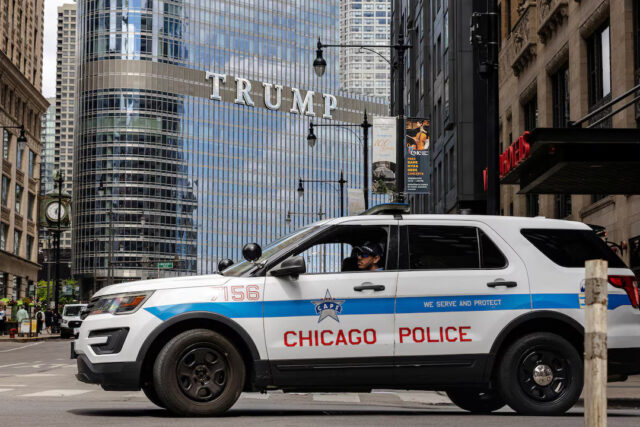 7ZRSB6BQUNNGTOBITFNJZJBCZI A Chicago police car sits in traffic outside of Trump International Hotel and Tower as U.S. President Donald Trump said on Monday that the U.S. military might deploy to Chicago, Illinois, U.S., August 25, 2025. REUTERS/ Jim Vondruska