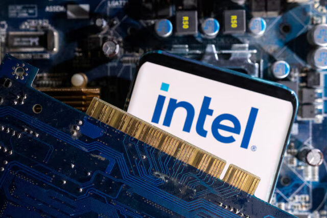 C3POJQ5BZRKENKOIM5ZOOMKE6U A smartphone with a displayed Intel logo is placed on a computer motherboard in this illustration taken March 6, 2023. REUTERS/Dado Ruvic/Illustration/File Photo