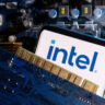 A smartphone with a displayed Intel logo is placed on a computer motherboard in this illustration taken March 6, 2023. REUTERS/Dado Ruvic/Illustration/File Photo