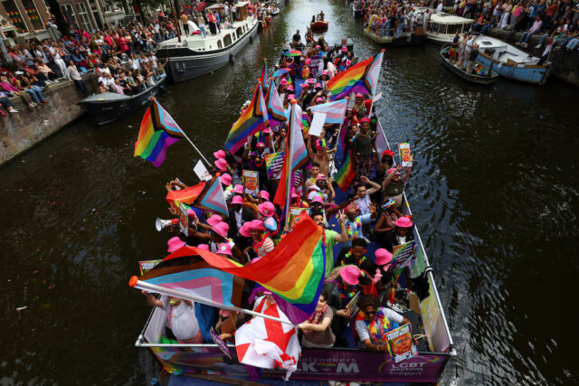 CWA3PXTD25JT7ECXX3IKVAHRDE A boat filled with participants cruises the UNESCO World Heritage recognized canals during the annual gay pride parade in Amsterdam, Netherlands August 2, 2025. REUTERS/Yves Herman