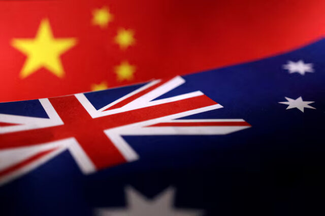 EERNMPM7QBMNBNZFHKFNW4YZMM Printed Chinese and Australian flags are seen in this illustration, July 21, 2022. REUTERS/Dado Ruvic/File Photo