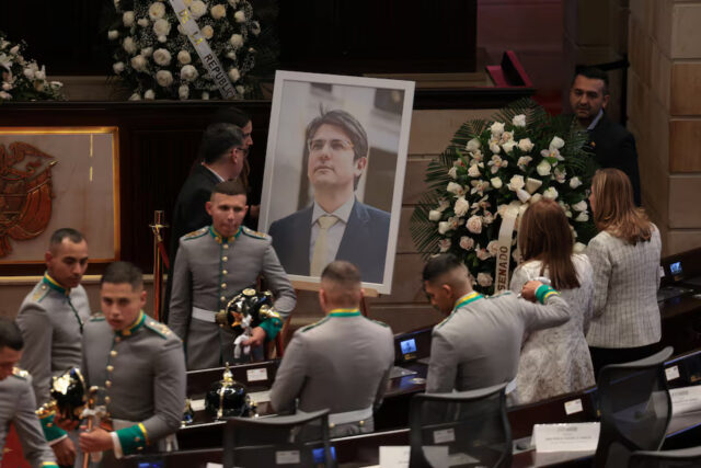 JZZRMKJRYZJ65CLSOJIO4HITL4 An image of Senator Miguel Uribe Turbay, who was shot in the head at a campaign event on June 7, ahead of the arrival of his coffin at Colombia's Congress, where a tribute will be held, in Bogota, Colombia, August 11, 2025. REUTERS/Luisa Gonzalez