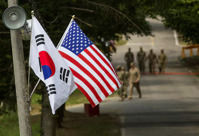 LFU364X7RJJRRB45IZDYVHKPNU The South Korean and American flags fly next to each other at Yongin, South Korea, August 23, 2016. Courtesy Ken Scar/U.S. Army/Handout via REUTERS/File Photo