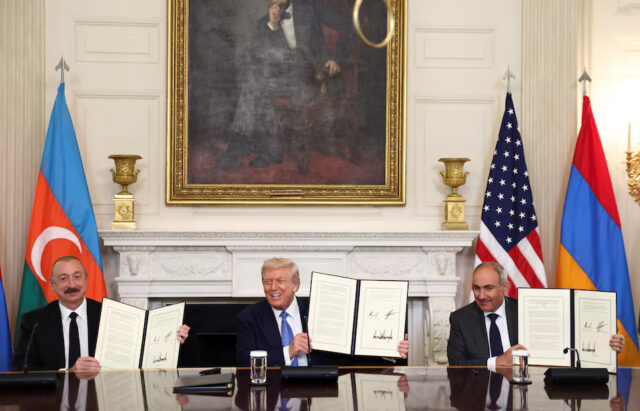 SFKCH3O6FZPF3KHJB6A64OJSEQ U.S. President Donald Trump, Azerbaijan's President Ilham Aliyev, and Armenia's Prime Minister Nikol Pashinyan pose with their documents during a trilateral signing event at the White House, in Washington, D.C., August 8, 2025. REUTERS/Kevin Lamarque/File Photo
