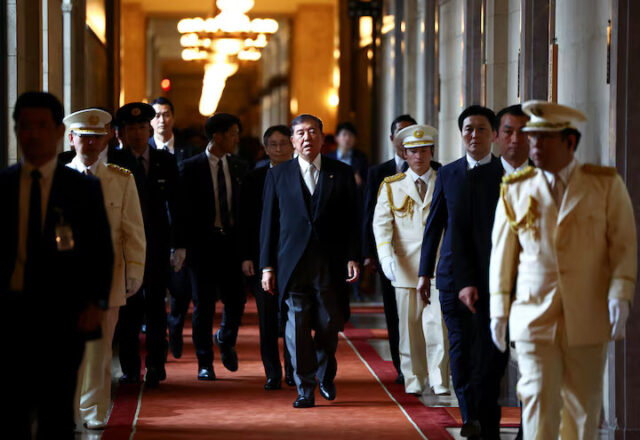 SN723OBI2BMG5KSC6OF5P6DELY Japan's Prime Minister Shigeru Ishiba, wearing a formal attire, walks toward the upper house hall to attend an opening ceremony of the parliamentary session in Tokyo, Japan August 1, 2025. REUTERS/Issei Kato/File Photo