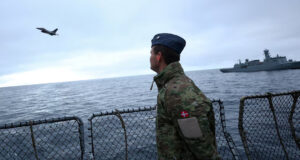 Denmark Excludes US Military From Largest Arctic Drill In Greenland’s History A Danish F-16 fighter jet flies over the frigate Niels Juel as Danish and French armed forces perform military drills off the coast of Nuuk, Greenland, September 15, 2025. REUTERS/Guglielmo Mangiapane