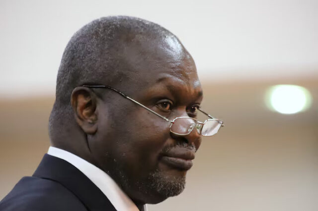 South Sudan's First Vice President Riek Machar takes the oath of office at the State House in Juba, South Sudan, February 22, 2020.