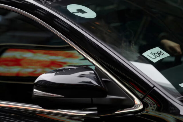 Uber sign is seen on a car in New York, U.S., April 12, 2019. REUTERS/Shannon Stapleton/File Photo