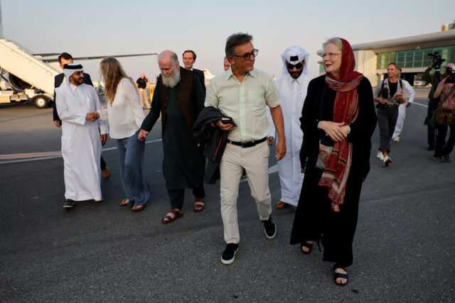 British couple Peter and Barbie Reynolds, who were released from Taliban detention in Afghanistan, walk after disembarking from a plane, in Doha, Qatar September 19, 2025. REUTERS/Ibraheem Abu Mustafa