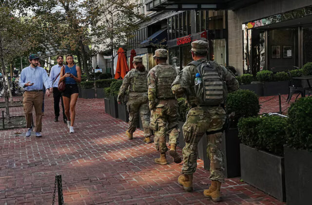 QKYUYYCXPNLZ3LYR2QW5LOBRTU Members of the National Guard patrol near Dupont Circle weeks after U.S. President Donald Trump deployed the National Guard and ordered an increased presence of federal law enforcement in Washington, D.C., U.S., September 2, 2025. REUTERS/Leah Millis