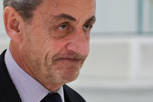 Former French President Nicolas Sarkozy walks, as he attends his trial with twelve other defendants on charges of corruption and illegal financing of an election campaign related to alleged Libyan funding of his successful 2007 presidential bid, at the courthouse in Paris, France, March 27, 2025. REUTERS/Gonzalo Fuentes/ File Photo