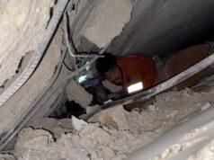 Israel Launches Strikes In Gaza After Ceasefire Breach Claim A rescuer works to free people trapped in rubble after an Israeli strike in Gaza City, October 28, 2025, in this still image taken from video. Obtained by Reuters/Handout via REUTERS