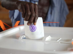 Tanzania Orders Curfew After Election Violence A man casts his vote during the general election at a polling station in Dar es Salaam, Tanzania, October 29, 2025. REUTERS/Emmanuel Herman