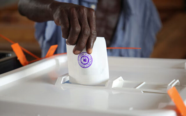A man casts his vote during the general election at a polling station in Dar es Salaam, Tanzania, October 29, 2025. REUTERS/Emmanuel Herman