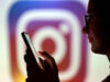Meta To Let Parents Disable Teen Chats With AI Characters A teenager poses for a photo while holding a smartphone in front of a Instagram logo in this illustration taken September 11, 2025. REUTERS/Dado Ruvic/Illustration/File Photo