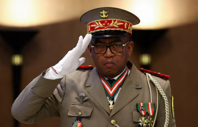 OB252FRCL5OVVDBHF6XRXY3EG4 Military general Ruphin Fortunat Zafisambo gestures after being named Prime Minister by Madagascar's President Andry Rajoelina at the Lavoloha Presidential Palace, following the government's dissolution amid protests over power and water shortages, in Antananarivo, Madagascar October 6, 2025. REUTERS/Siphiwe Sibeko