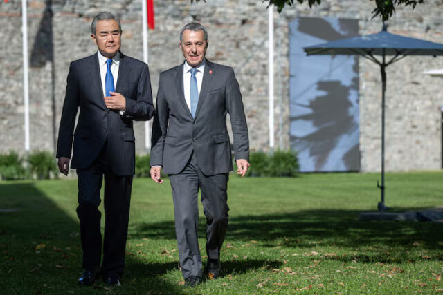 WXTEAC3J25NL7IBGTP4SQYTK5U China's Foreign Minister Wang Yi and Swiss Foreign Minister Ignazio Cassis walk during an official visit at Castelgrande in Bellinzona, Switzerland, October 10, 2025. ELIA BIANCHI/Pool via REUTERS