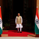 Indian Prime Minister Narendra Modi walks at Hyderabad House, New Delhi. REUTERS/Adnan Abidi