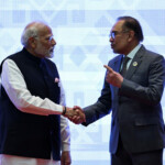 Prime Minister Narendra Modi shakes hands with Malaysia's Prime Minister Anwar Ibrahim during the 21st ASEAN-India Summit at the National Convention Centre, in Vientiane, Laos. REUTERS/Athit Perawongmetha