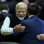 Prime Minister Narendra Modi embraces Vietnam's Prime Minister Pham Minh Chinh during the 21st ASEAN-India Summit at the National Convention Centre, in Vientiane, Laos. REUTERS/Athit Perawongmetha