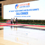 Prime Minister Narendra Modi (L) greets Laos' Prime Minister Sonexay Siphandone (2nd R) and his wife Vandara Siphandone (R) as he arrives to attend the gala dinner during the 44th and 45th Association of Southeast Asian Nations (ASEAN) Summits in Vientiane. TANG CHHIN SOTHY/Pool via REUTERS