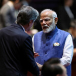 Prime Minister Narendra Modi speaks to U.S. Secretary of State Antony Blinken as they attend the 19th East Asia Summit (EAS) at the National Convention Centre, in Vientiane, Laos. REUTERS/Athit Perawongmetha