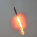 SpaceX's Super Heavy booster flies during SpaceX's Starship's fifth flight test, in Boca Chica, Texas, U.S., October 13, 2024. REUTERS/Kaylee Greenlee Beal