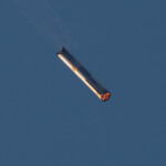 Super Heavy booster flies during SpaceX's Starship's fifth flight test, in Boca Chica, Texas, U.S., October 13, 2024. REUTERS/Kaylee Greenlee Beal
