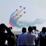 People watch the Bayi aerobatic team of the Chinese People's Liberation Army (PLA) Air Force perform at the China International Aviation and Aerospace Exhibition, or Airshow China, in Zhuhai, Guangdong province, China November 12, 2024. REUTERS/Tingshu Wang