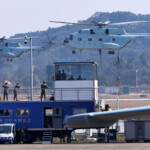 Members of the Chinese People's Liberation Army (PLA) Navy climb off a transport helicopter at the China International Aviation and Aerospace Exhibition, or Airshow China, in Zhuhai, Guangdong province, China November 12, 2024. REUTERS/Tingshu Wang TPX IMAGES OF THE DAY