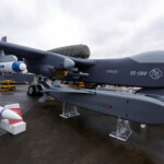 A Jetank (SS-UAV) drone is displayed alongside munitions at the China International Aviation and Aerospace Exhibition, or Airshow China, in Zhuhai, Guangdong province, China November 14, 2024. REUTERS/Tingshu Wang