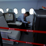 A man sits at a display of cabin systems at the Aviation Industry Corporation of China (AVIC) booth, during the China International Aviation and Aerospace Exhibition, or Airshow China, in Zhuhai, Guangdong province, China November 14, 2024. REUTERS/Tingshu Wang