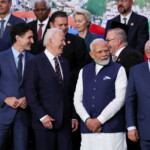 Canada's Prime Minister Justin Trudeau, U.S. President Joe Biden, Prime Minister Narendra Modi and Brazil's President Luiz Inacio Lula da Silva and French President Emmanuel Macron interact as world leaders gather for a group photo during the G20 summit in Rio de Janeiro, Brazil, November 19, 2024. REUTERS/Leah Millis/Pool