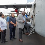Guyana PM Brig (Retd) Mark Phillips entering HAL-228 aircraft (Courtesy: PM Brigadier Mark Phillips via Facebook)
