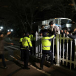 Police officers block the entry to the National Assembly after South Korean President Yoon Suk Yeol declared martial law in Seoul, South Korea, December 3, 2024. Yonhap via REUTERS