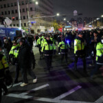 Police officers walk among the crowd, after South Korean President Yoon Suk Yeol declared martial law, in Seoul, South Korea, December 4, 2024. REUTERS/Kim Hong-Ji