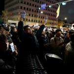 A person gestures while standing among the crowd outside the National Assembly, after South Korean President Yoon Suk Yeol declared martial law, in Seoul, South Korea, December 4, 2024. REUTERS/Kim Soo-hyeon