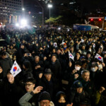 People gesture outside the National Assembly, after South Korean President Yoon Suk Yeol declared martial law, in Seoul, South Korea, December 4, 2024. REUTERS/Kim Soo-hyeon