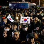 People gather outside the National Assembly, after South Korean President Yoon Suk Yeol declared martial law, in Seoul, South Korea, December 4, 2024. REUTERS/Kim Soo-hyeon