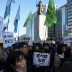 People hold banners calling for the resignation of South Korean President Yoon Suk Yeol during a rally, in Seoul, South Korea, December 4, 2024. REUTERS/Kim Hong-Ji